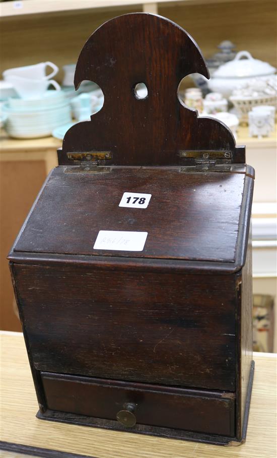 A George III oak candle box, height 44cm